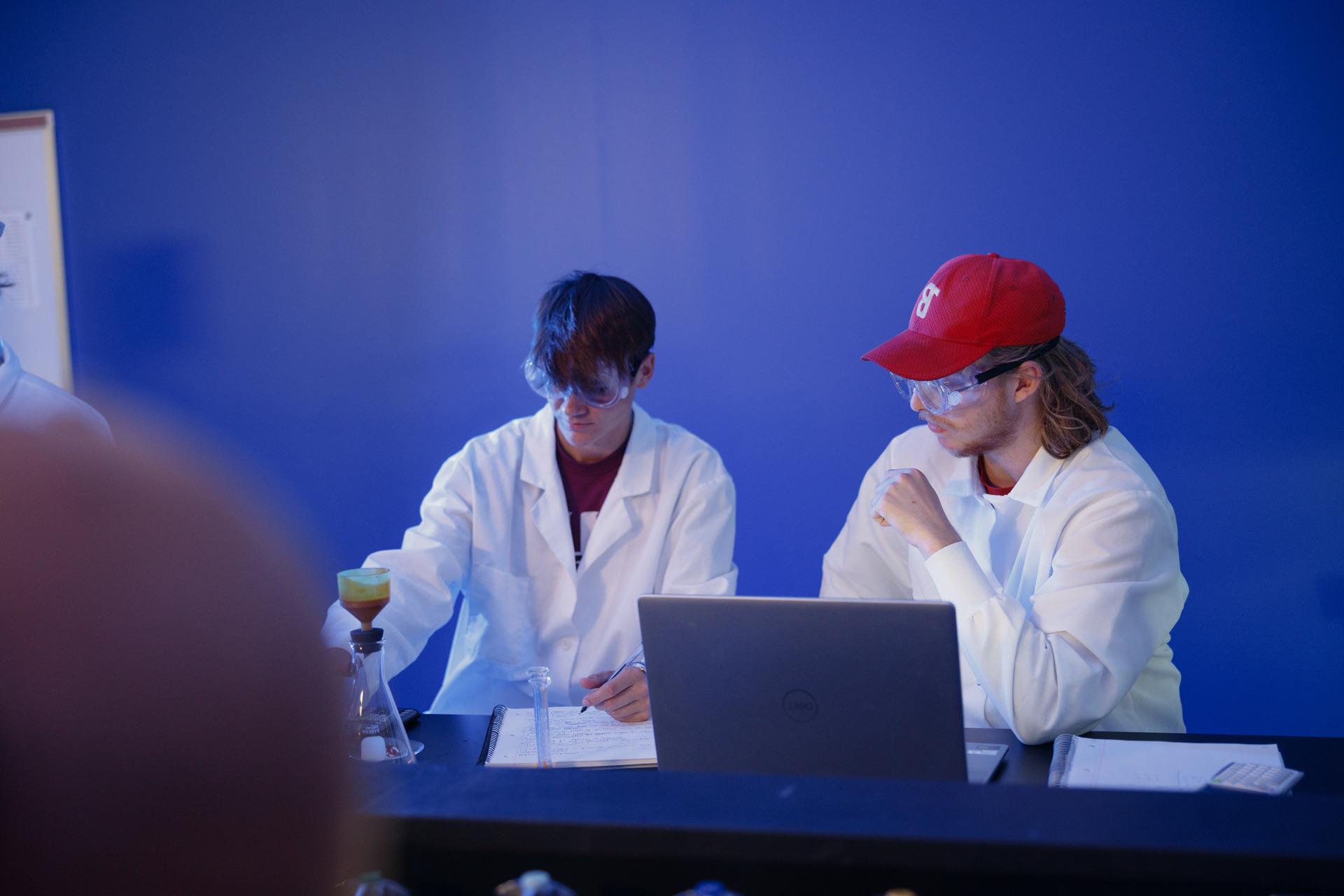 A scientist mixing chemicals in flasks